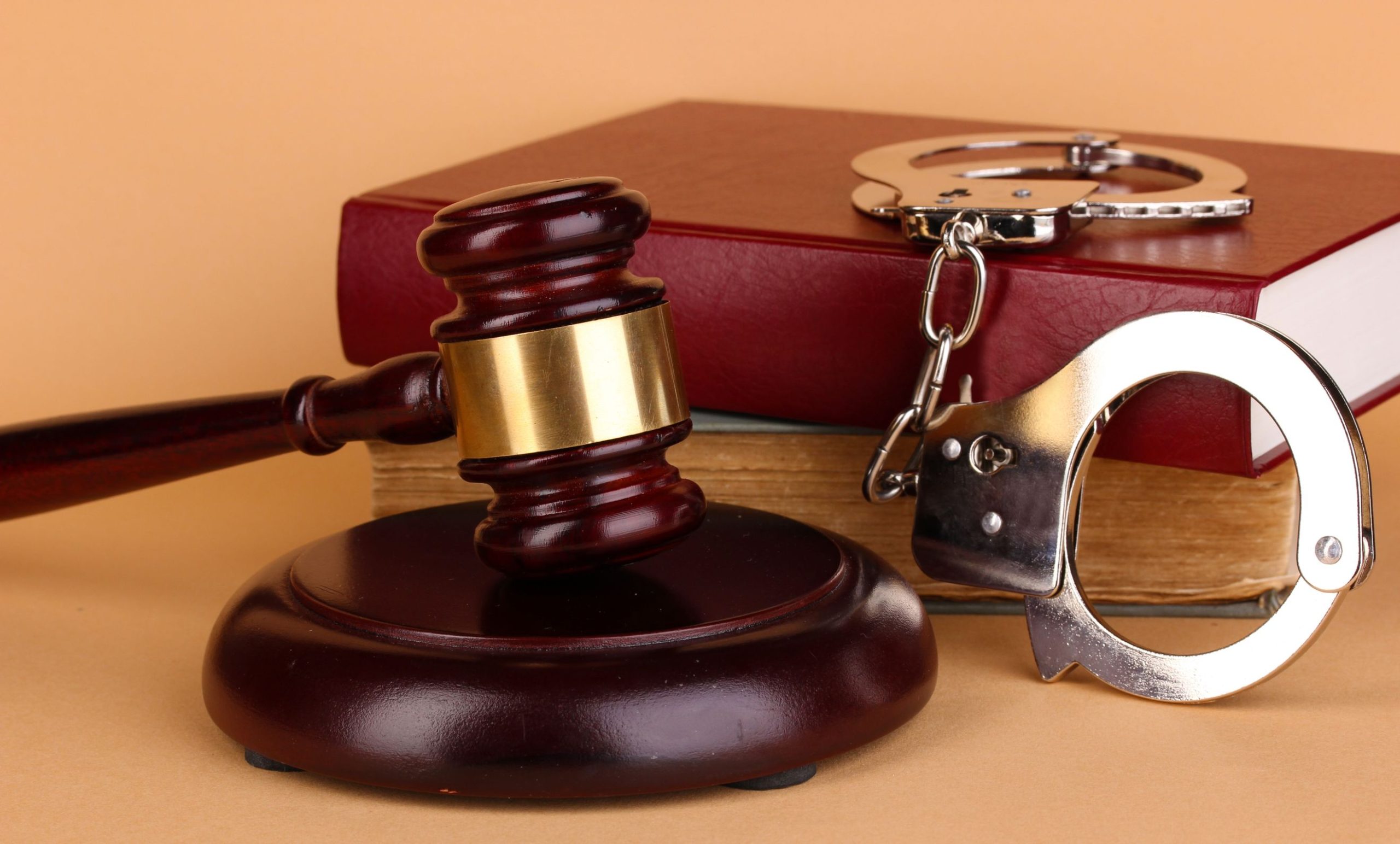gavel, handcuffs, and law book