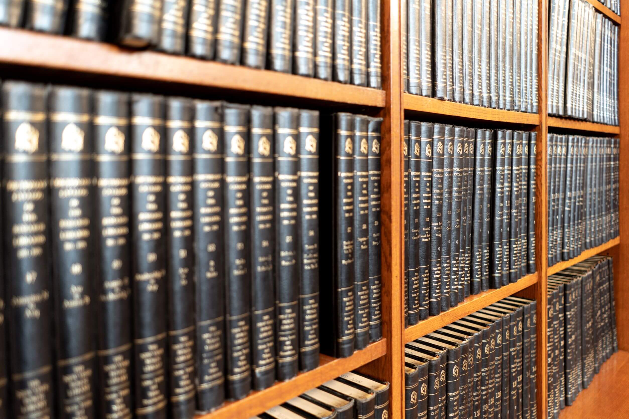 Law library in a law office full of black and gold books