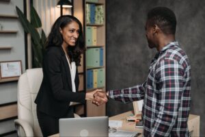 criminal defense lawyer and client shaking hands