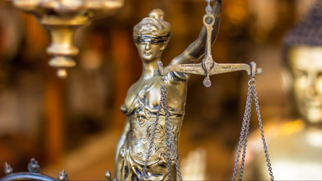 Blindfolded Justice Symbolic Figurine holds weights